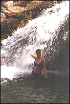 Anke underneath a water fall